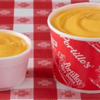 Cheese Sauce · One of our most craveable menu items! Our drool-worthy, smooth cheddar cheese sauce tastes b...