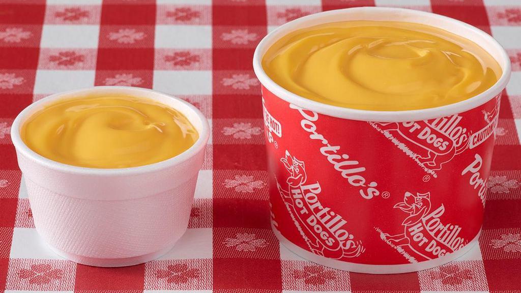 Cheese Sauce · One of our most craveable menu items! Our drool-worthy, smooth cheddar cheese sauce tastes best as a dipping sauce for our salty, crinkle-cut French fries.  Available in regular or jumbo cheese sauce.