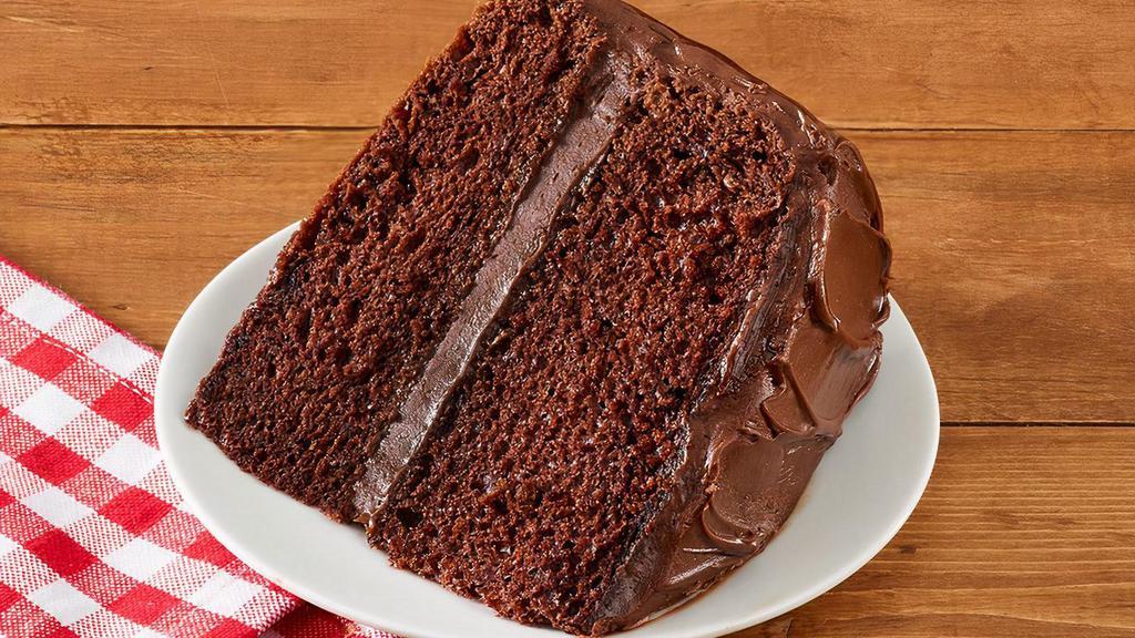 Chocolate Cake Slice · Our famous, homemade, fluffy chocolate cake is baked with love every morning in each restaurant. Each double-layer chocolate cake is generously iced with two pounds of rich, chocolate frosting.