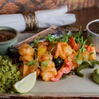 Grilled Shrimp Fajitas · Onions and peppers, black beans, avocado crema, mexican cilantro-lime rice, tortillas, charr...