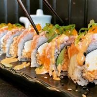 Salmon Lover Roll · Spicy krab salad, avocado, and cream cheese topped seared salmon, masago, and green onion