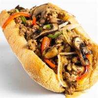 Impossible Cheesesteak Sandwich · Impossible cheesesteak with grilled onions, peppers and mushrooms.