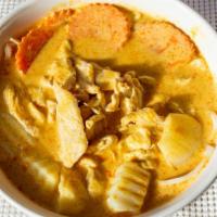 Yellow Chicken Curry · Spicy. Mild spicy. Yellow curry with chicken, potatoes, carrots, onions, and coconut milk.