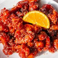 Orange Chicken · Spicy. Crispy coated chicken seared in a sweet orange peel sauce sprinkled with sesame seeds.