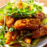 Chili Garlic Fish (House Specialty) · Spicy. Medium spicy. Crispy fish fillet topped with garlic and chili sauce on a bed of lettu...