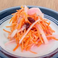 Pickled Carrots · Vegan. Thinly-sliced carrots, red onions, cranberries.