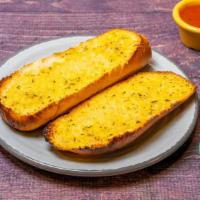Garlic Bread · Includes marinara. Buttery bread that is topped with garlic.