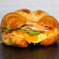 Croissant, Bacon, Turkey, Avocado, Egg, & Cheddar  · 2 scrambled eggs, melted Cheddar cheese, sliced smoked turkey, smokey bacon, avocado, and Sr...