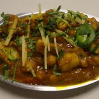 Aloo Sholle · Garbanzo beans and potatoes cooked in special blend of spices.