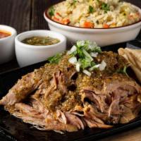 Smoked Chili Verde · 16-hour smoked and braised pork shoulder shredded and piled high.