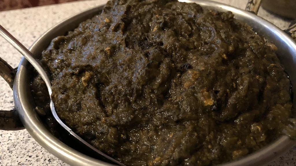 Palak Paneer · Homemade Cottage cheese cubes cooked in spinach gravy.