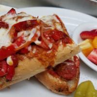 Sausage Feast · Italian sausage topped with sauteed bell peppers, onion, and marinara sauce and baked with m...