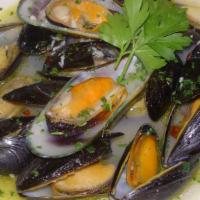 Black Mussels · Simmered in garlic white wine broth and fresh-diced tomatoes.