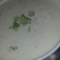 New England Clam Chowder · Creamy chowder with premium clams, potatoes, celery, and green onions.
