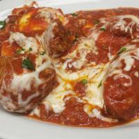 Classic Combo · Two cheese ravioli, one manicotti, one sausage, one meatball, baked with meat sauce, and Moz...