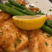 Chicken Francese · Crispy, egg battered breasts of chicken on top of a lemon cream sauce, garnished with fresh ...