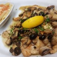 Chicken Piccata · Chicken breasts sautéed in a lemon, white wine sauce with black olives, mushrooms, capers, a...
