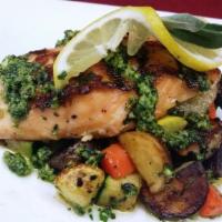 Grilled Wild Salmon Pesto · Wild salmon, grilled and placed over a bed of oven-roasted vegetables with fingerling potato...