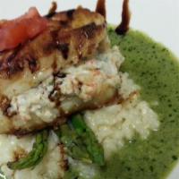 Stuffed Wild Halibut · Shrimp and herb stuffed wild halibut pan seared and topped over creamy risotto, fresh aspara...