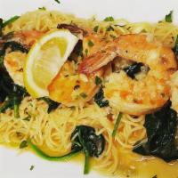 Shrimp Scampi · Jumbo shrimp in a lemon, garlic, and wine sauce and served over capellini pasta and spinach.