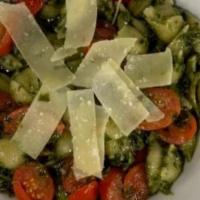 Pesto Genovese · housemade pesto sauce with cream, grape tomatoes, tossed with penne & topped off with Parmig...