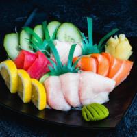 Deluxe Sashimi (12Pc) · Sashimi Grade Sliced Raw Yellowtail (3), Salmon (3), Tuna (3), Red Snapper (3). Serves with ...