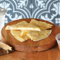 Kids Quesadillas · A 12-inch flour tortilla filled with cheddar and queso blanco cheeses, grilled crisp, and se...