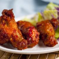 Spicy Tokyo Chicken Wings · Deep fried chicken wings with our signature sauce on the side five pieces.