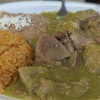 Chile Verde · Tender and tasty pork in our salsa Verde! Served with rice, refried beans, queso fresco, and...
