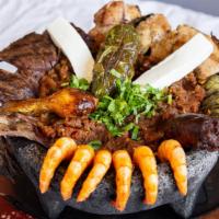 Molcajete Nayarit · Classic, authentic, and satisfying! Fire grilled steak, shrimp, chicken, and chorizo in our ...