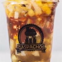Traditional Gaspacho · Mango, pineapple, jicama, fresh squeezed orange juice, Mexican cheese, and black chili.