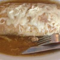 Wet Burrito · Choice of meat, beans, guacamole, rice, salsa, sour cream, cheese, lettuce, tomatoes, topped...