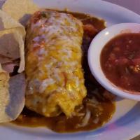 Burrito Ranchero · Flour tortilla stuffed with beef and spicy chicken covered with melted jack, cheddar cheese,...