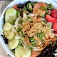 Garlic Salmon Sashimi Rice Bowl · Fresh salmon sashimi, roasted garlic, Jalapeño, cucumber, white onion, radish on rice and be...