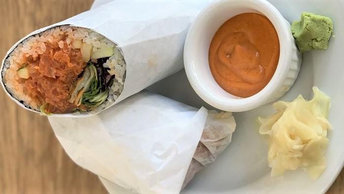 Spicy Salmon Bow-Lito · Spicy salmon (raw), green onion, cucumber, rice, spring mix salad wrapped in seaweed. Spicy mayo on the side.