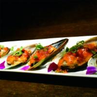 Baked Mussels · Baked mussels served with special bake sauce, topped with green onion and masago