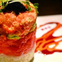 Ahi Tower · Spicy Tuna, spicy crab salad, avocado, sushi rice served with spicy mayo and eel sauce toppe...