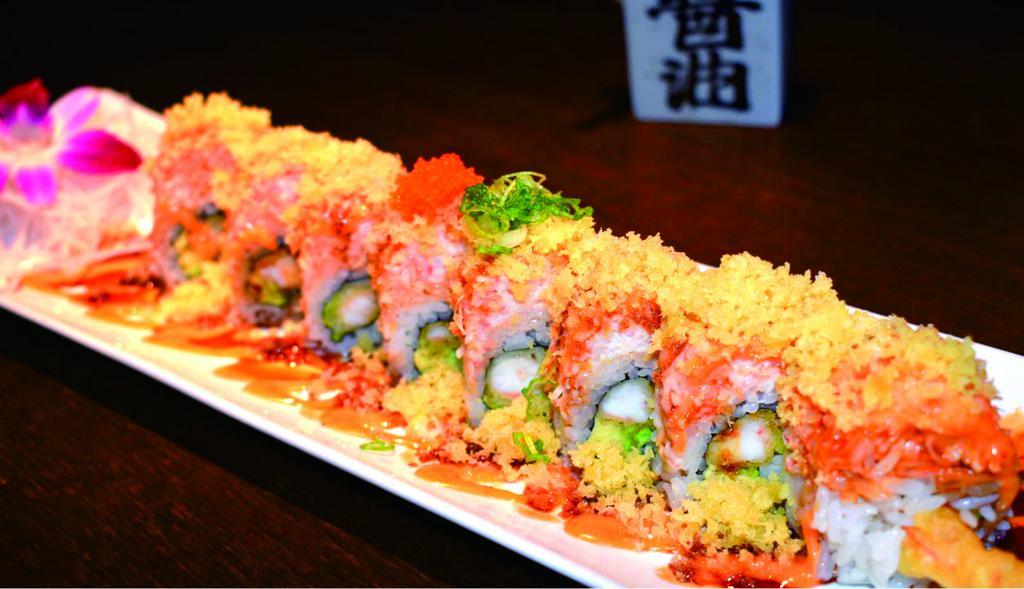 Fresno Roll · Shrimp Tempura, avocado, and cucumber, topped with spicy crab salad served with spicy mayo, eel sauce, crunch, masago, and green onion