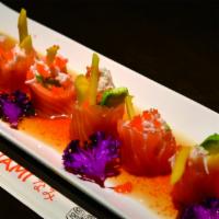 Butterfly Kiss Roll · Crab, cucumber, and mango, wrapped in salmon sashimi, served with ponzu sauce and masago