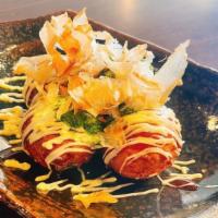 Takoyaki · 4pieces. Okonomiyaki sauce, Mayo, Seaweeds ,Bonito flakes on top