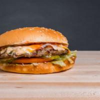 Cheeseburger (1/4Lb) · Toasted burger bun with an all-beef patty, American cheese, lettuce, tomato, pickles, red re...