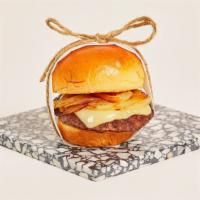 French Onion Soup Slider · Juicy beef patty covered in caramelized onions and melted mozzarella on a toasted bun.