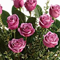 Hey Gorgeous Bouquet · This gorgeous bouquet includes 12 lavender roses, oregonia, and lemon leaf. Delivered in a g...