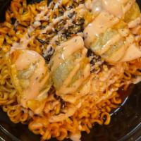 Legend Spicy Noodle  With Rice · Noodles boiled down w/ Special House spicy sauce . crispy Dumplings on top w/ LHC sauce