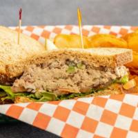 Tuna Salad Sandwich · Classic tuna salad made fresh and served on fresh baked hoagie roll or Wheat bread with lett...