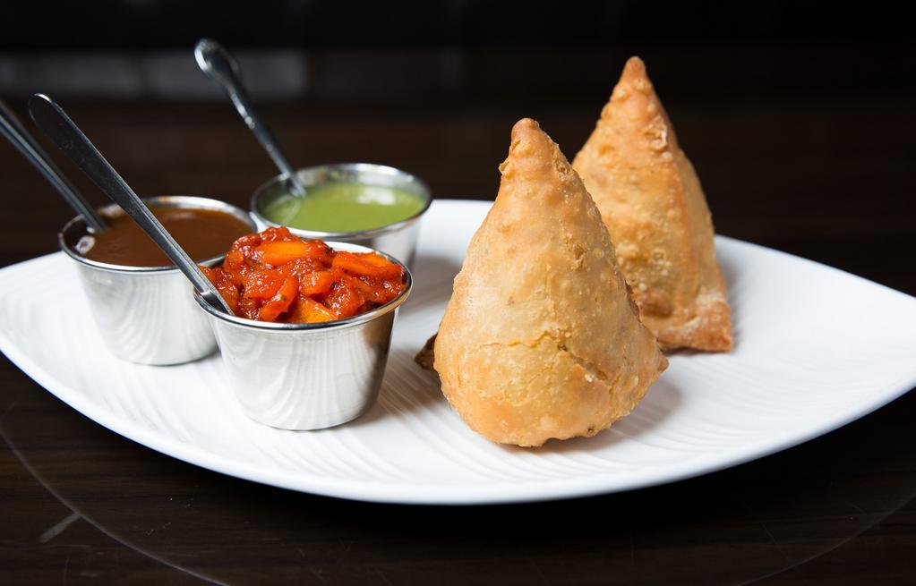 Vegetable Samosa · Crispy pastry turnover filled with mix veg and potato.