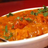 Butter Chicken · Special BBQ chicken cooked with tomato cream & butter.