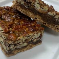 Pecan Bar · Thick buttery shortbread crust topped with a sweet filling and crunchy pecans.