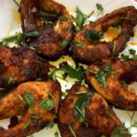 Andhra Fish Fry · Small fish steaks (Tilapia) marinated with south indian spiced batter, curry leaves  and fri...