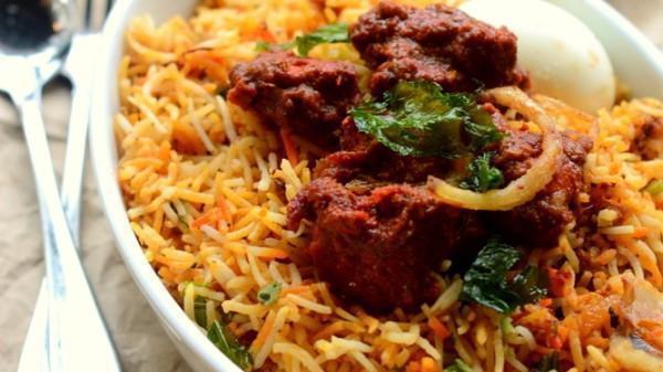 Vijayawada Chicken Biryani · Aromatic Basmati rice made with Indian herbs served over Boneless chicken pieces cooked with curry leaves and house special sauce.